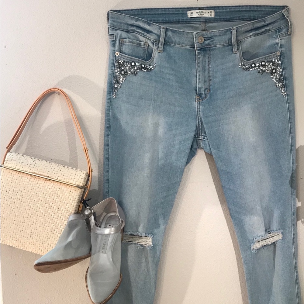 Embellished light wash distressed jeans